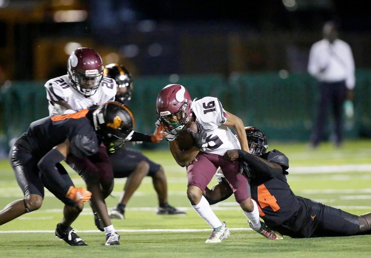 Booker T. WashingtonTornadoes defender tackles Norland Vikings wide receiver Tarell Short (16) during football game on Thursday, October 6, 2022 at Traz Powell Stadium in Miami. Andrew Uloza / for Miami Herald