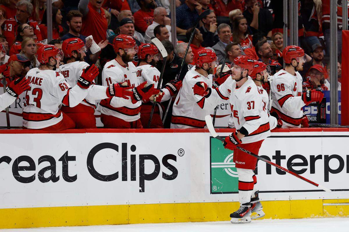 May 15, 2025; Washington, District of Columbia, USA; Carolina Hurricanes right wing Andrei Svechnikov (37) celebrates with teammates after scoring the go ahead goal against the Washington Capitals late in the third period in game five of the second round of the 2025 Stanley Cup Playoffs at Capital One Arena. Mandatory Credit: Geoff Burke-Imagn Images