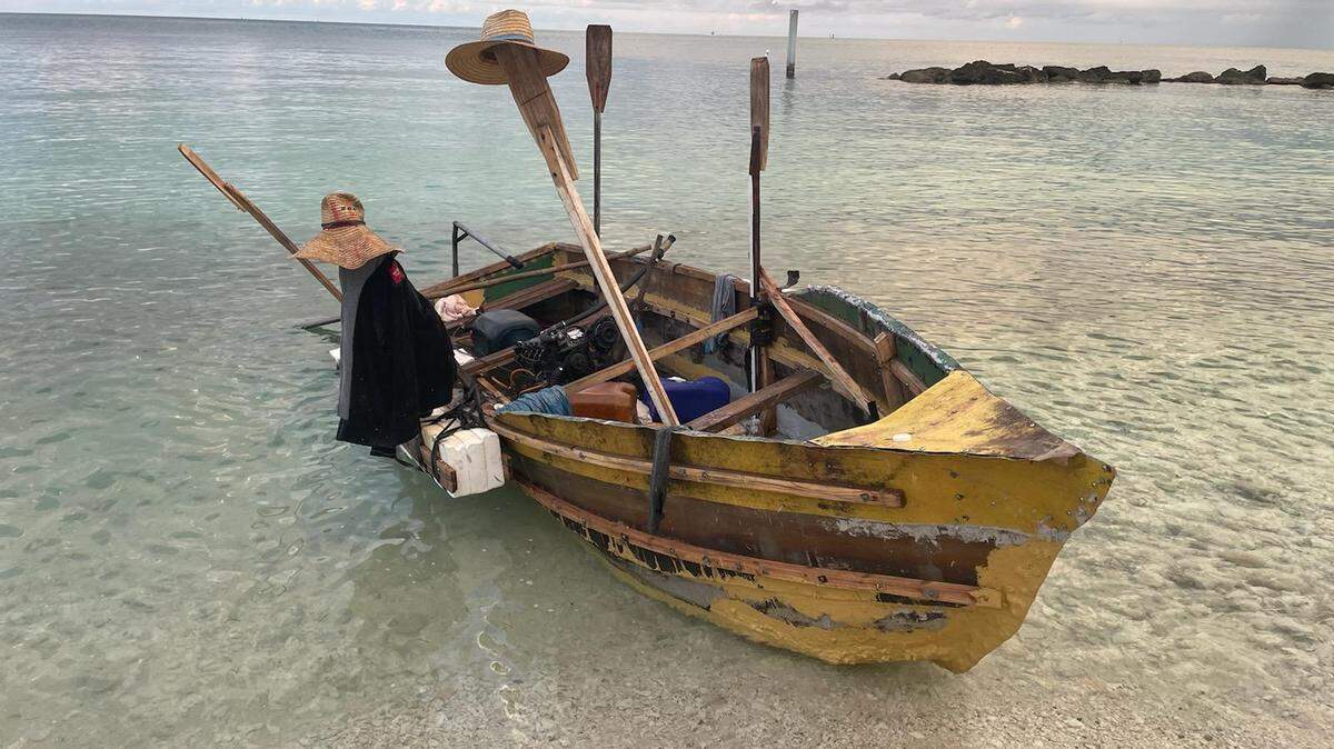 A wooden boat is beached at Fort Zachary Taylor Historic State Park Tueday, May 17, 2022. The Border Patrol said 15 migrants from Cuba came ashore on the vessel.