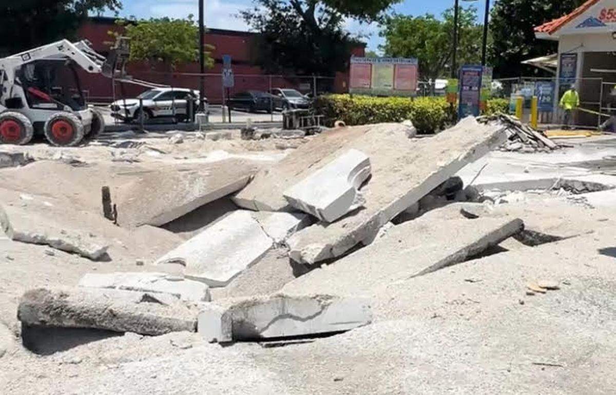 A parking lot is buckled because of an underground fuel tank explosion at a Hallandale Beach gas staion Tuesday, June 4, 2024.
