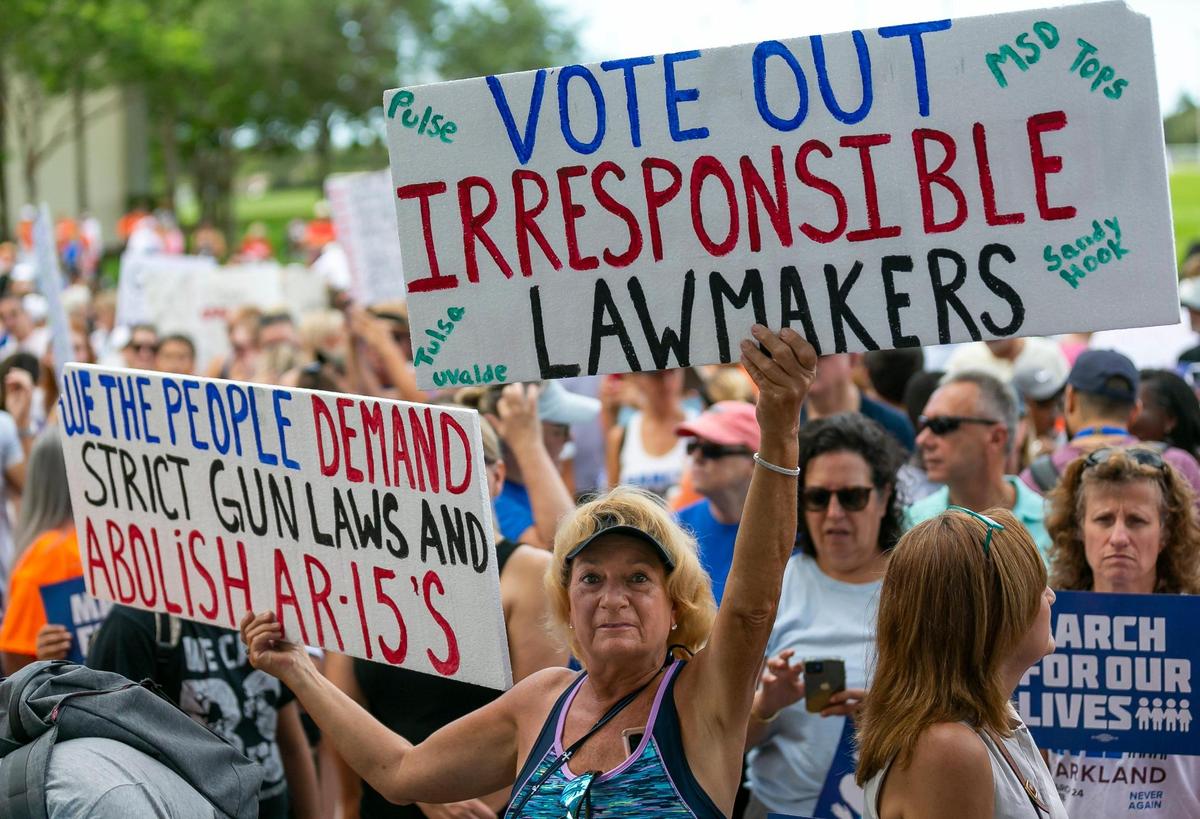 Protestors participate in the March For Our Lives rally at Pine Trails Park on Saturday, June 11, 2022 in Parkland, Fla. One of the main goals of the rally is to increase pressure on politicians to pass laws that help prevent gun violence.