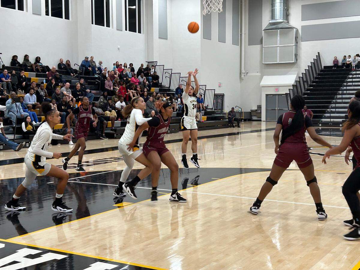 American Heritage sophomore Jasleen Green pulls up for a jump shot during Monday’s Region 4-5A semifinal against Miami Norland at the American Heritage gym.