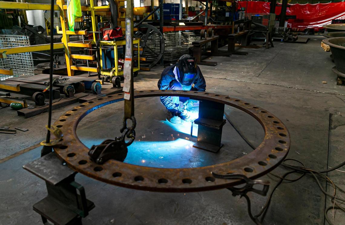 Antonio Newry, a welder fabricator, at work at MWI in Deerfield Beach. The company is redesigning its plant in Broward County and expanding one in Vero Beach as the demand for pumps soars.