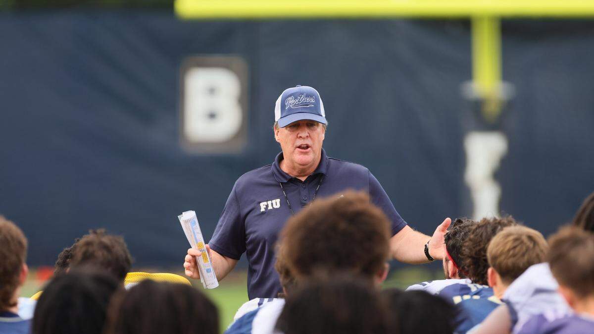 FIU Golden Panthers head coach Mike MacIntyre talks to his players during football practice at Florida International University in Miami, Florida, Thursday, March 28, 2024.