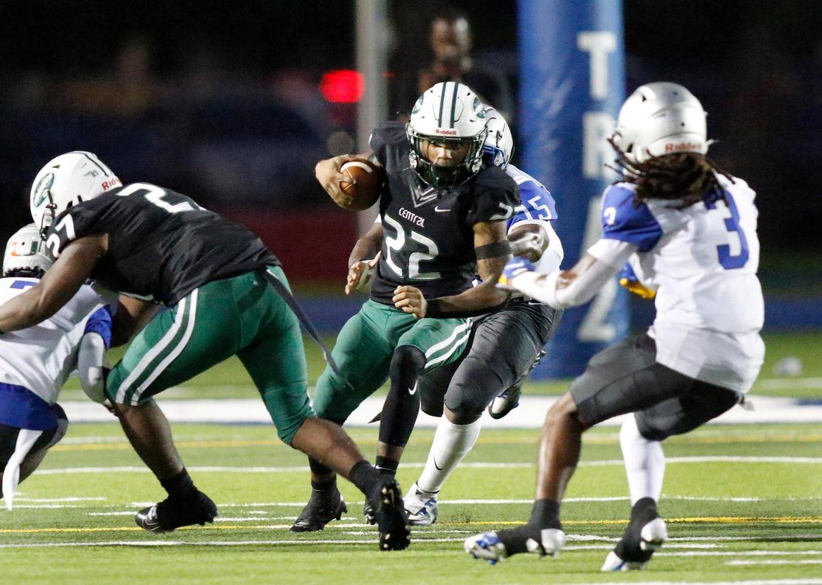 Miami Central Rockets running back Jonathan Harris (22) tries to evade Dillard Panthers defenders during football game on Saturday, September 24, 2022 at Traz Powell Stadium in Miami. Andrew Uloza / for Miami Herald