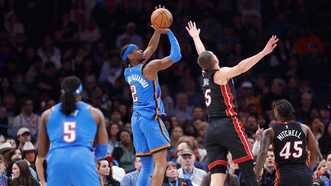 Oklahoma City Thunder guard Shai Gilgeous-Alexander (2) shoots as Miami Heat forward Nikola Jovic (5) defends during the second quarter at Paycom Center.