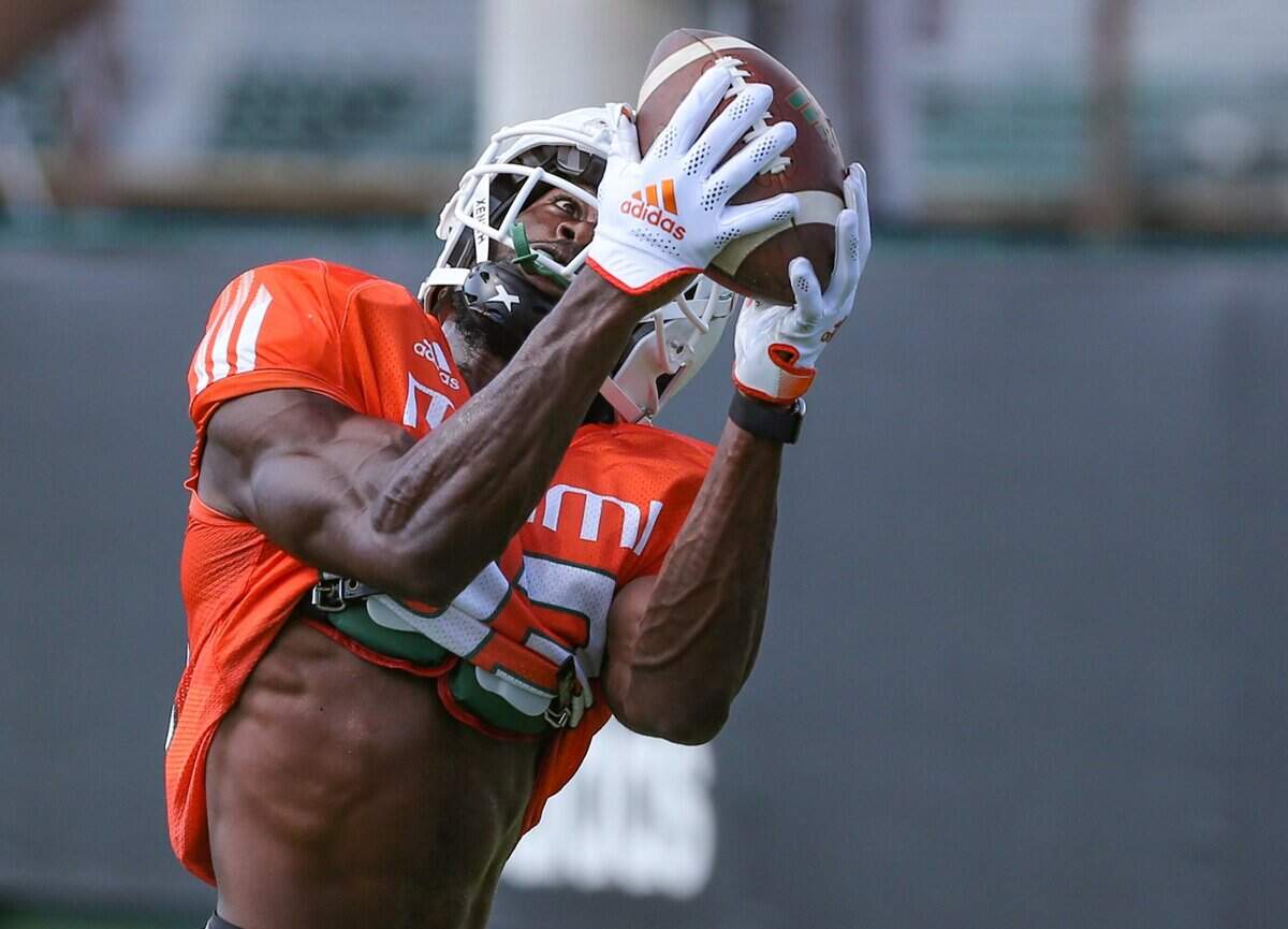 Miami Hurricanes wide receiver Michael Redding III (83) catches a pass at the University of Miamis Greentree Field in Coral Gables on Tuesday, August 31, 2021.