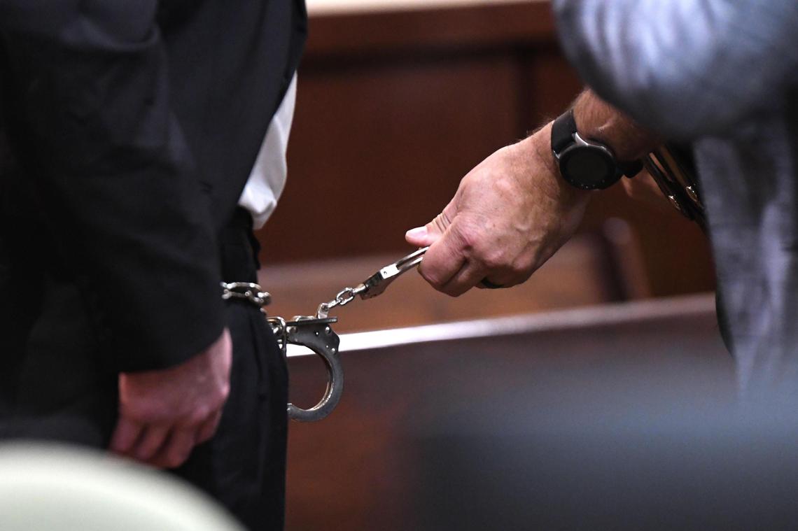 Sigfredo Garcia waits for his shackles to be removed before taking his seat in the courtroom Friday, Oct.11, 2019.