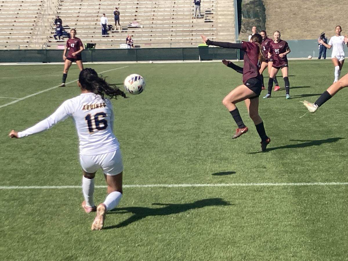 St. Thomas Aquinas’ Camila Velez Giraldo (left) readies to shoot what would be her game-winning goal in Wednesday’s Class 6A state girls’ soccer championship game in DeLand, Fla.