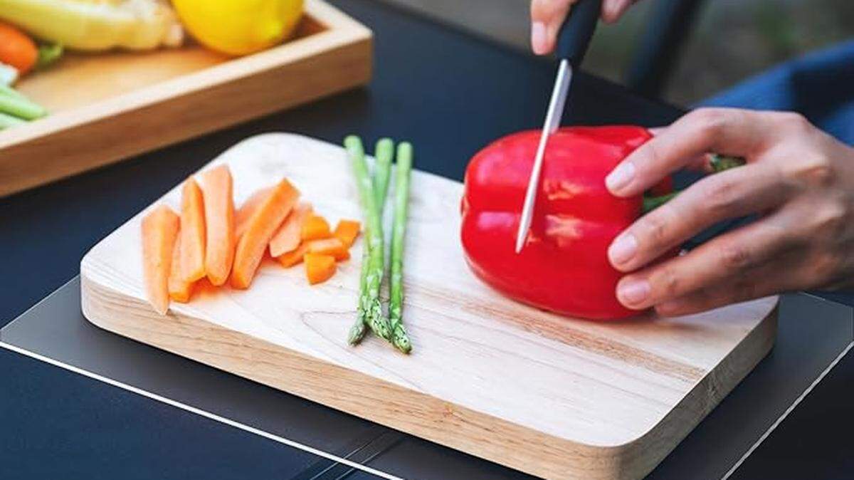 Use a separate cutting board for raw meats and fruits and vegetables .