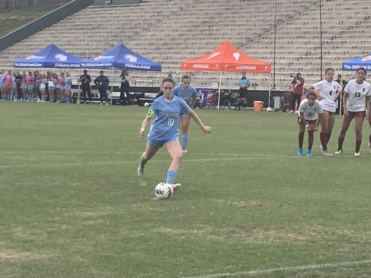 Lourdes’ Nicole Lee runs up to kick the game-winning penalty kick with 2:04 left in regulation to send the Bobcats to the Class 5A state championship match.
