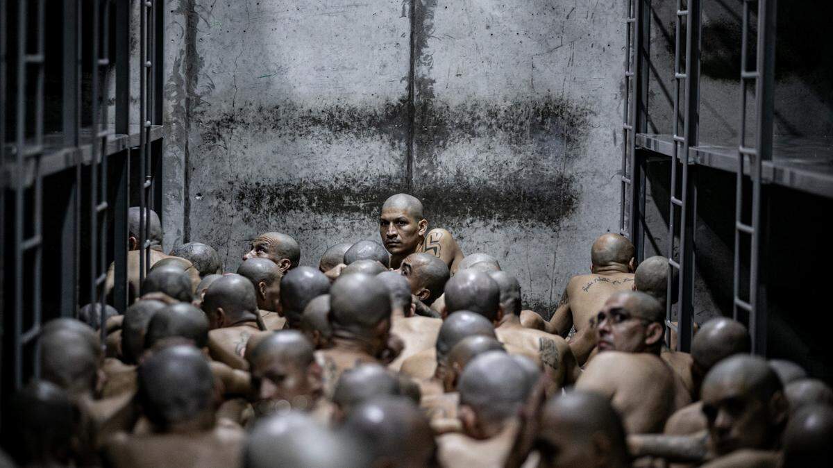 In this handout picture provided by the Salvadoran presidency inmates wait as 2,000 detainees are moved to mega- prison Terrorist Confinement Centre (CECOT) on June 11, 2024 in Tecoluca, El Salvador. Photo by Handout/Presidencia El Salvador via Getty Images