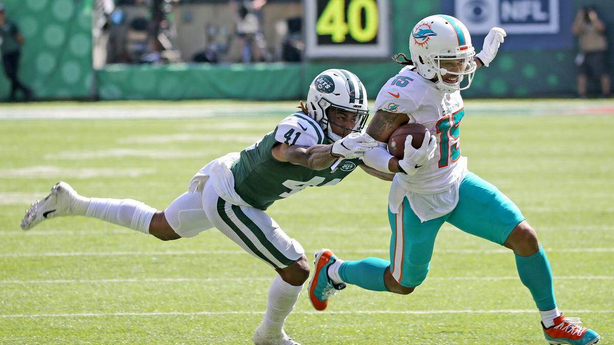 Miami Dolphins receiver Albert Wilson breaks away from New York Jets cornerback Buster Skrine to score a touchdown this past Sunday. Throughout his career, Wilson has shown a knack for shedding tackles.