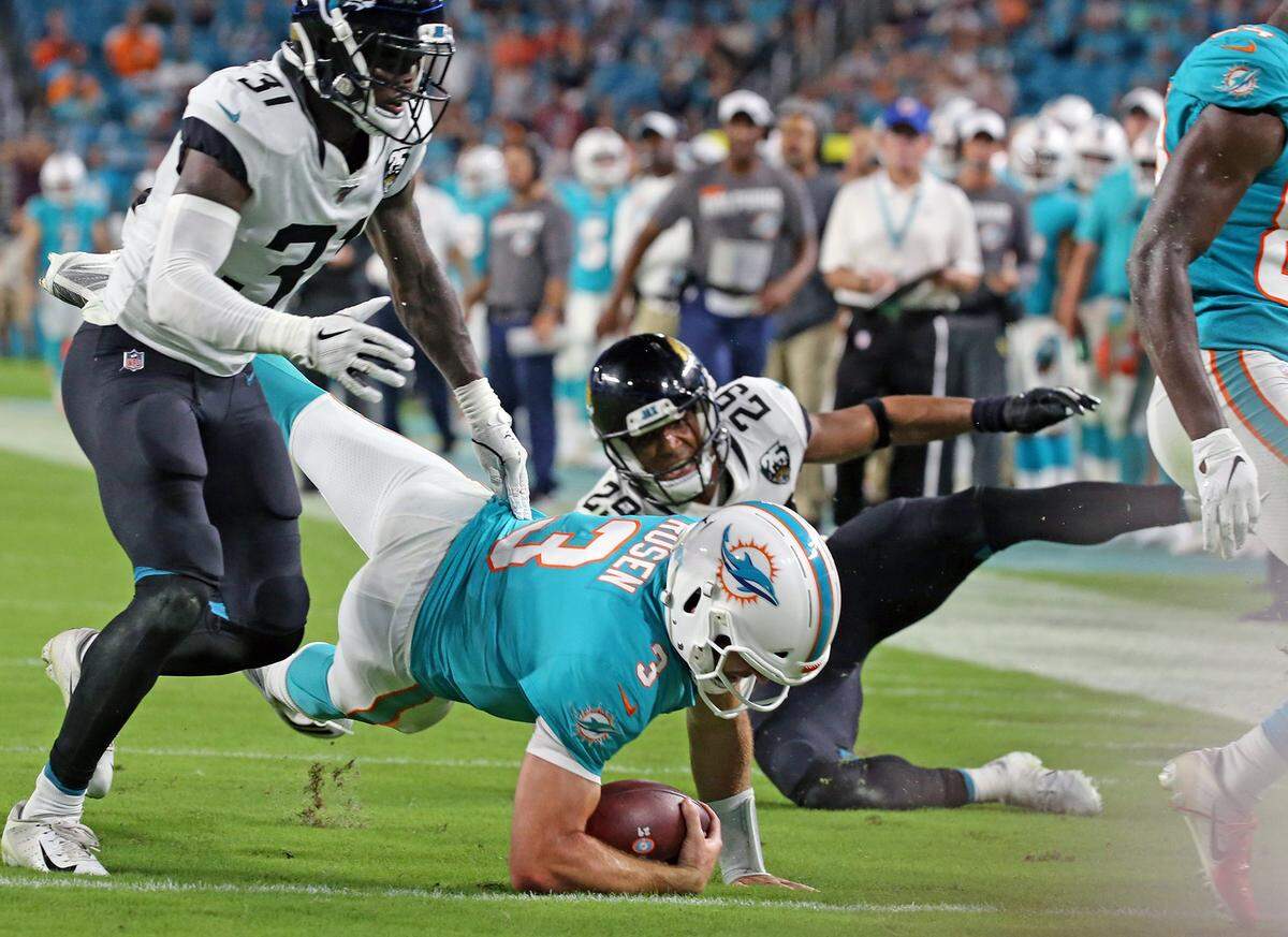 Miami Dolphins quarterback Josh Rosen (3) advances the ball to help setup a Fins fourth quarter touchdown as they play the Jacksonville Jaguars at Hard Rock Stadium in Miami Gardens, Florida, Thursday, August, 22, 2019.