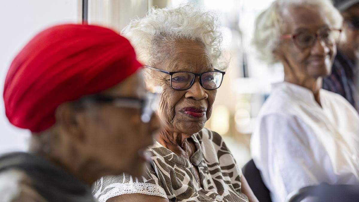 From left to right: Cynthia Lawrence, 89, Emma Bouie, 90, and Irene Pettigrew, 92, attend a luncheon at the Bethel House Bahamian American Museum on Saturday, Dec. 20, 2025, in Miami, Fla. They are among a group of six women being honored during the museum's inaugural Perrine Pioneer Women luncheon.