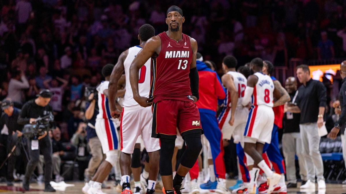 Miami Heat center Bam Adebayo (13) walks off the court after being scored on to lose the game 116-113 to the Detroit Pistons during the second half of an NBA game at Kaseya Center on March 19, 2025, in Miami.