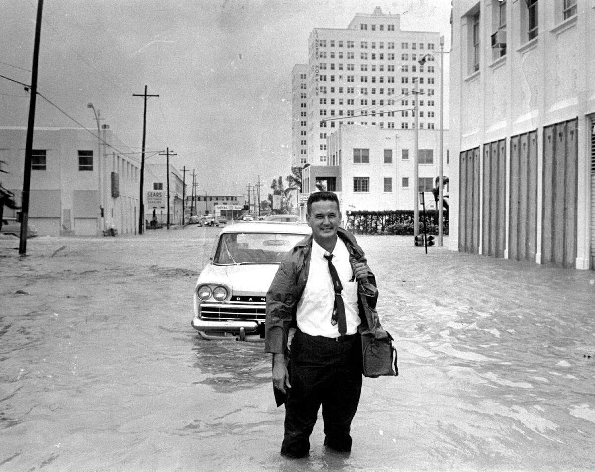 Miami Herald photographer Albert Coya during Hurricane Betsy in Miami.
