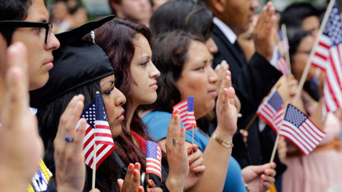 In 2013, DREAMers and parents take an oath in a mock citizenship ceremony in Washington, D.C.