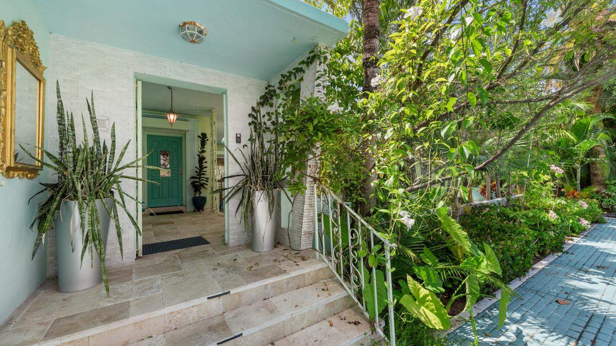 A waterfront single-family home landed on the market for $7.325 million. It once set the stage for a photo shoot and Telemundo hit series. Above: A look outside the house.