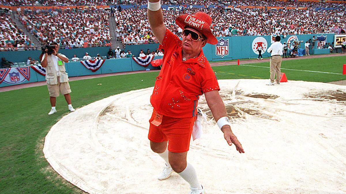 Photo by Vincent Laforet/HERALD STAFF: The Miami Dolphins official mascot Dolfan Denny boogies during the 2 Sep game against the New England Patriots.