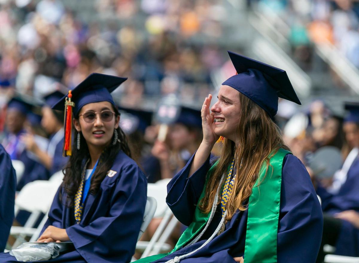 Florida International University student Beatriz Machado, 21, reacts during her graduation ceremony inside FIU’s Riccardo Silva Stadium in Miami, Florida on Saturday, April 30, 2022. Machado earned a bachelor’s degree in electrical engineering.