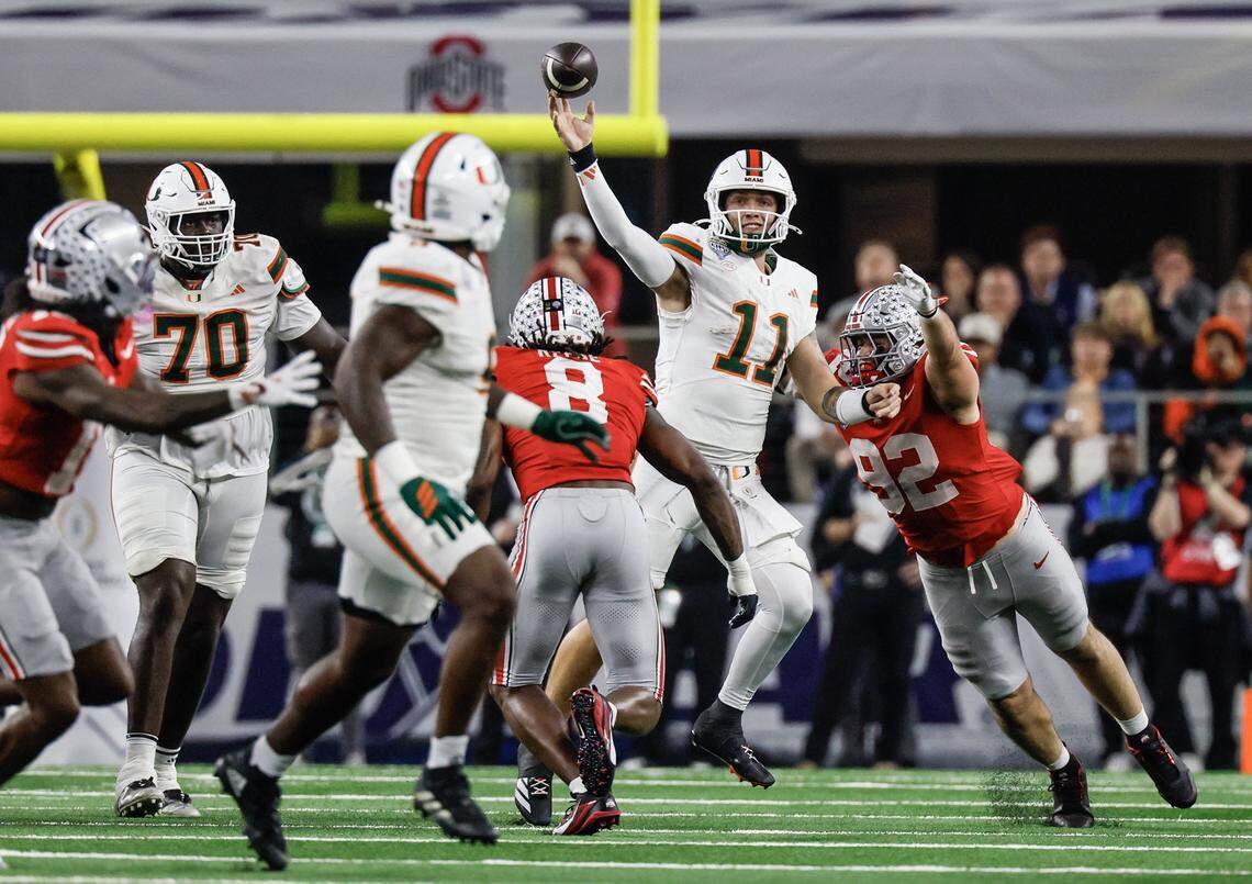 Miami Hurricanes quarterback Carson Beck (11) throws a pass during the second half of the College Football Playoff quarterfinal game against the Ohio State Buckeyes in the Cotton Bowl at AT&T Stadium in Arlington, Texas on Wednesday, December 31, 2025.