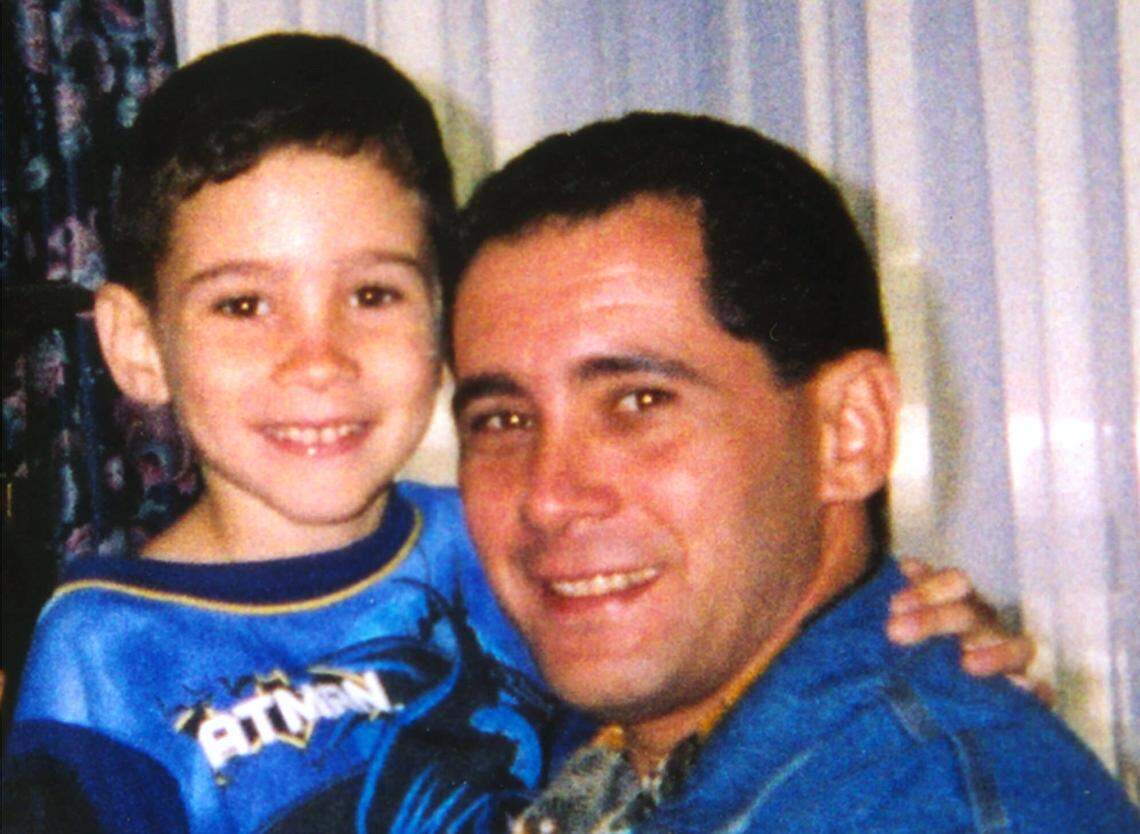 Juan Miguel Gonzalez holds his son Elian after a reunion at Andrews Air Force Base, Md.
