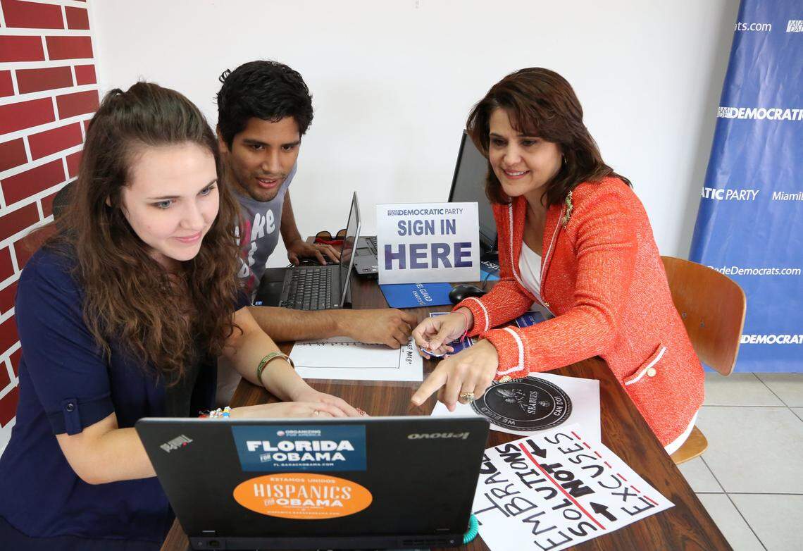 Juan Cuba, chairman of the Miami-Dade Democratic Party, pictured in a 2013 file photo with now-state senator Annette Taddeo, D-Miami, right, and fellow Democratic organizer Rachel Johnson.