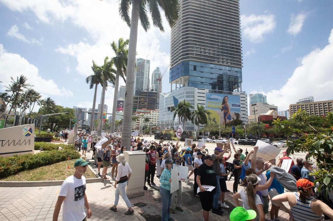Protesters gather at the Torch of Friendship in Miami, Florida, on Saturday, April 5, 2025, during the ‘Hands Off! Miami Fights Back’ demonstration, opposing the policies of President Donald Trump and his Senior Advisor, Elon Musk.