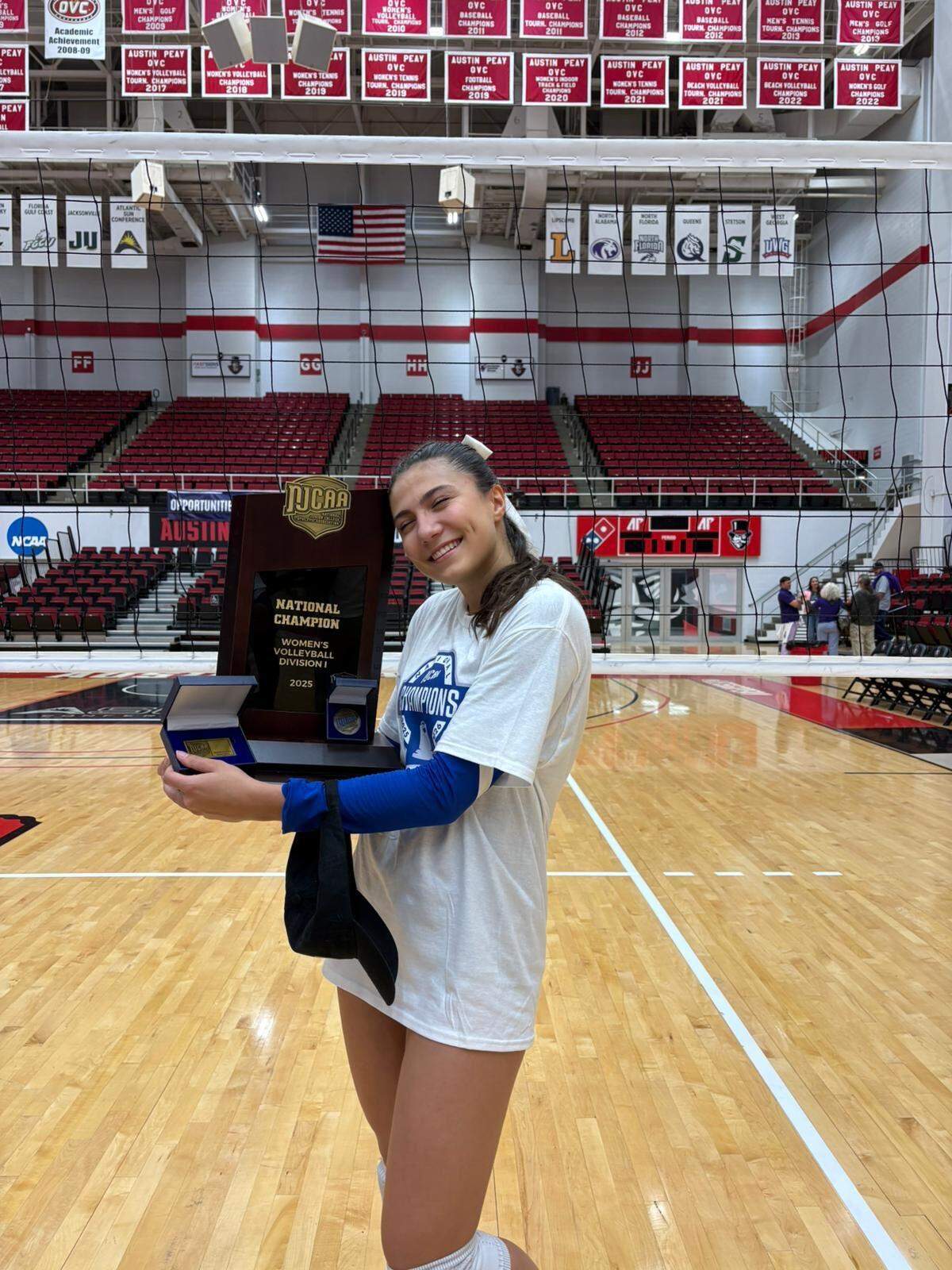 Miami Dade volleyball setter Eleonora Gicheva celebrate after the Sharks won a national title this past Saturday in Clarksville, Tennessee.