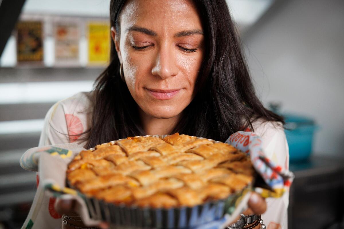 Natalia Martinez-Kalinina with one of her mango pies; you can order them on her Instagram account @sunnysliceco.