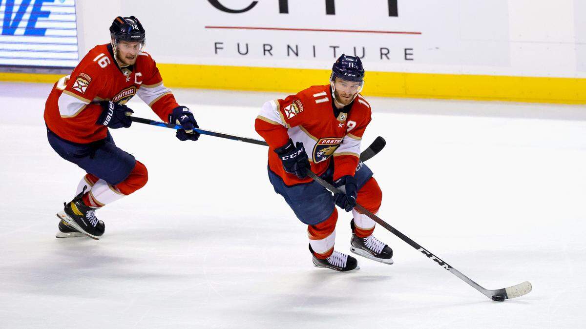 Florida Panthers left wing Jonathan Huberdeau (11) and Panthers center Aleksander Barkov (16) drives down the ice with the puck during a power play in the second period of an NHL game against the Ottawa Senators at the FLA Live Arena on Thursday, March 3, 2022 in Sunrise, Fl.