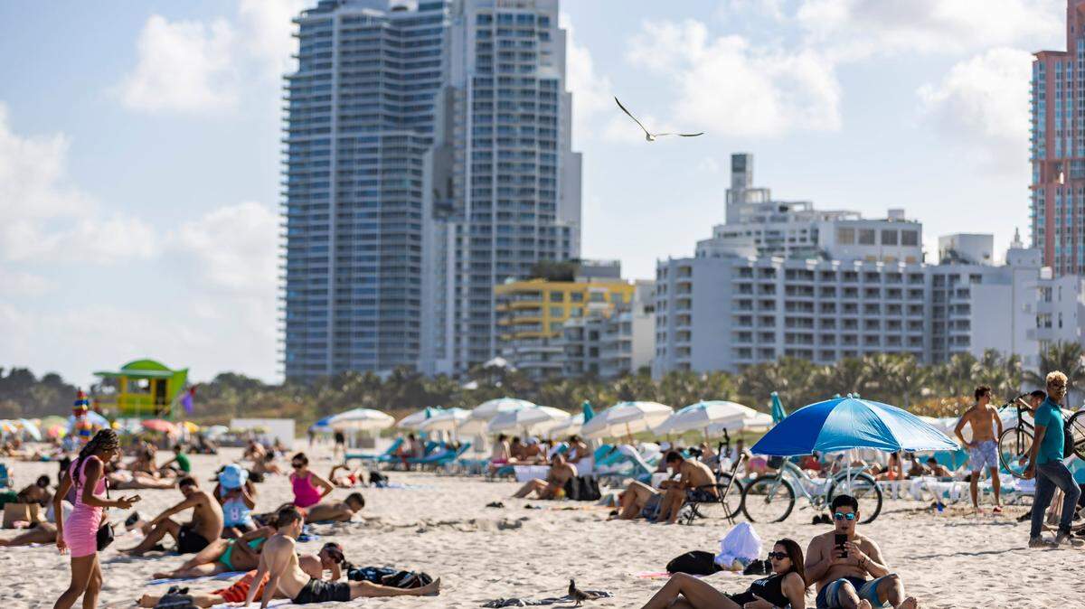 People visit South Beach during spring break on Friday, March 15, 2024, in Miami Beach, Fla. 