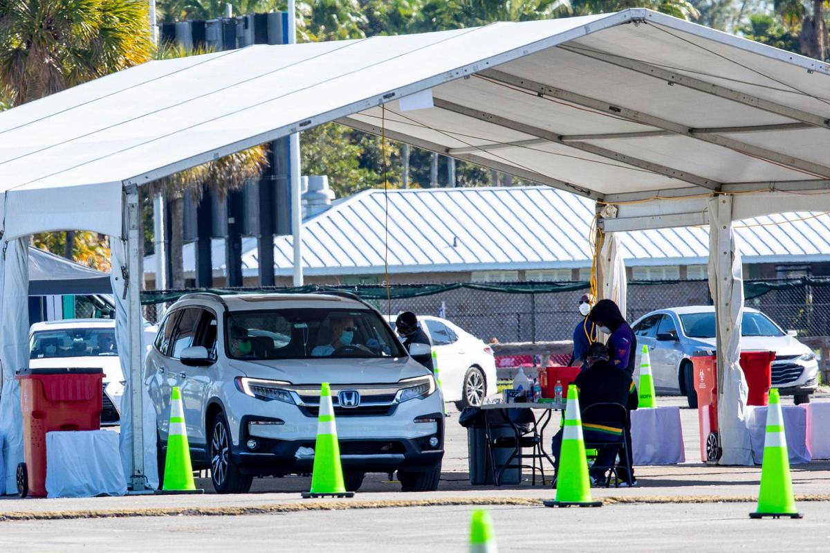Miami-Dade residents 65 or older line up in their cars as they wait for the COVID-19 vaccine at Tropical Park in Miami, Florida, on Sunday, January 10, 2021. All vaccination sites in the county require an appointment and no walk-ins are permitted.