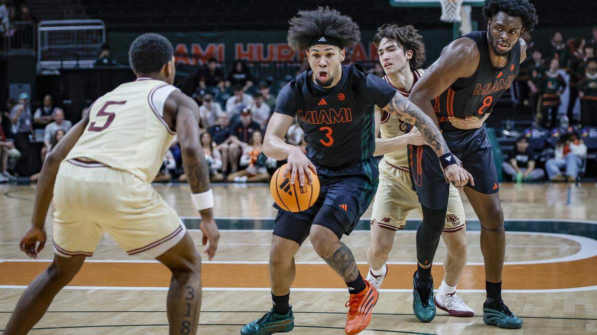 Miami Hurricanes guard Tre Donaldson (3) drives the ball as Boston College Eagles guard Fred Payne (5) defends in the second half at the University of Miami’s Watsco Center in Coral Gables, Florida, on Saturday, February 28, 2026.