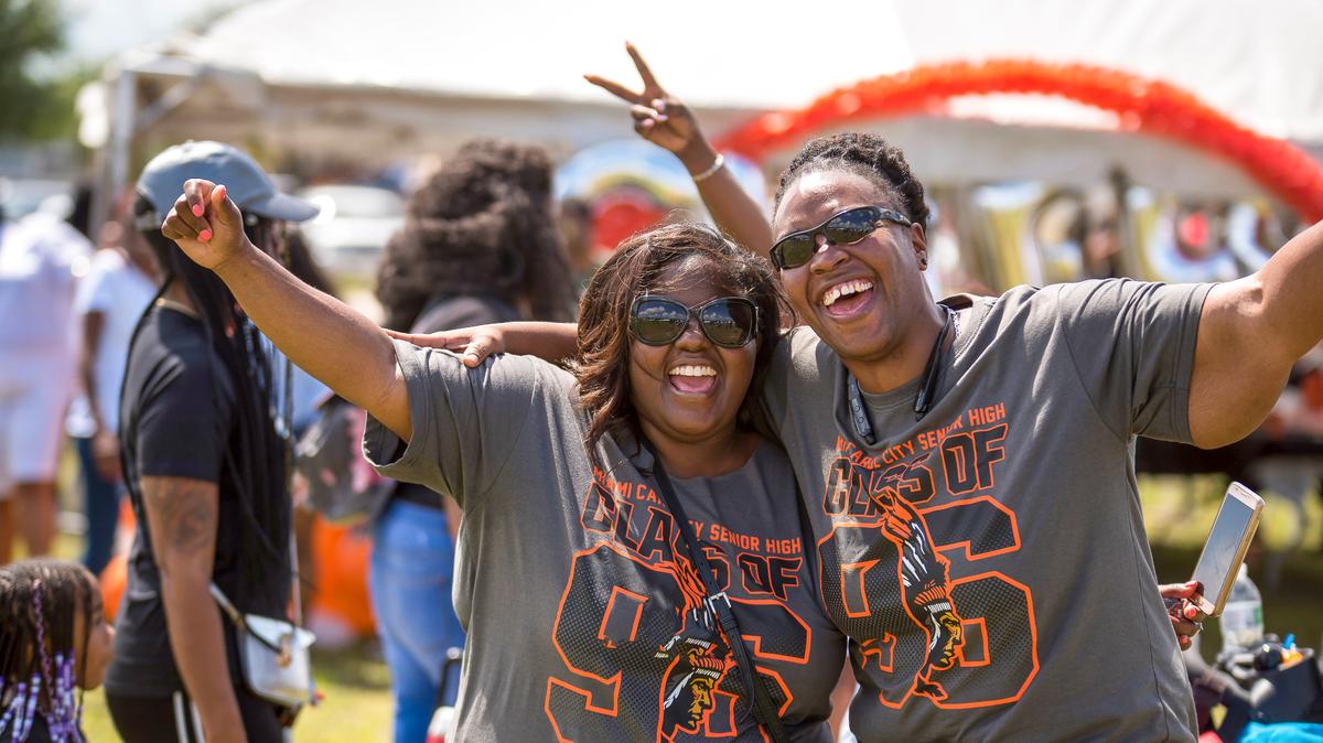 Two Miami Carol City Senior High School graduates class celebrate at the Chief Hall Picnic in Miami Gardens, Florida on Saturday, April 14, 2018. Beginning in 2016, the Chief Hall Picnic has allowed for Carol City alumni to come together and fellowship.