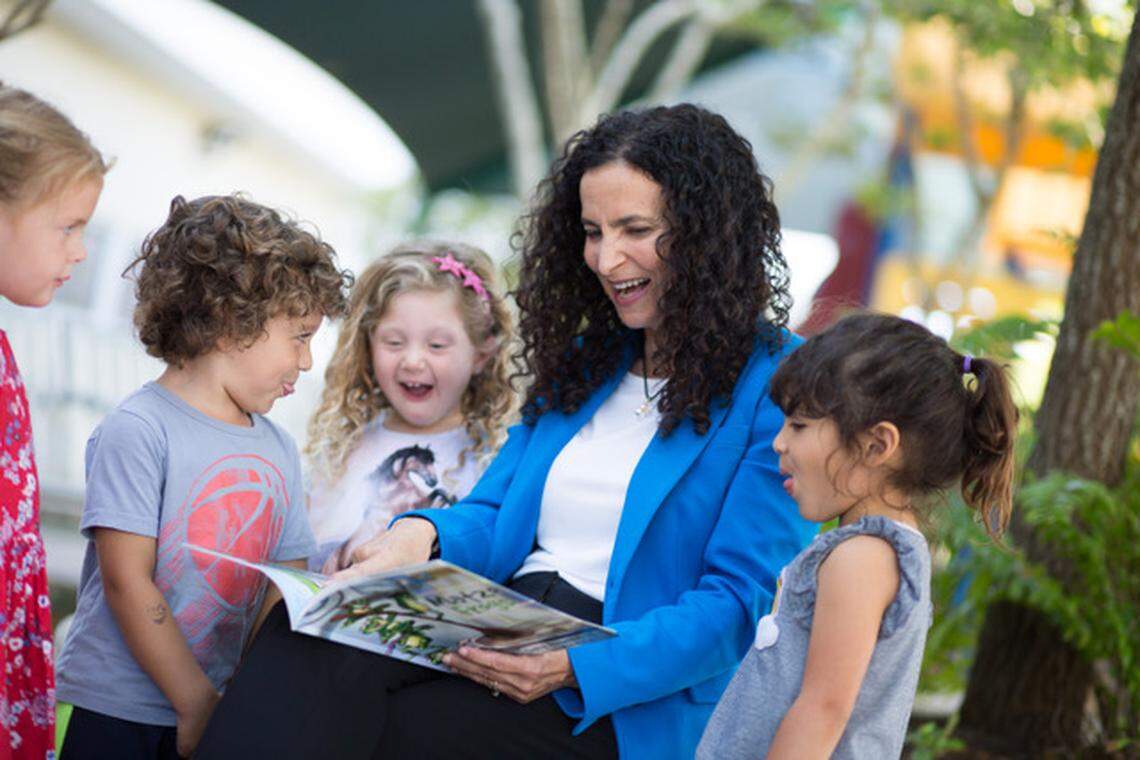 Gayle Pomerantz, the senior Rabbi at Temple Beth Shalom, with students who attend the temples infant to second-grade program. She will be installed as the first female Rabbi of the synagogue on Nov. 9, 2018.