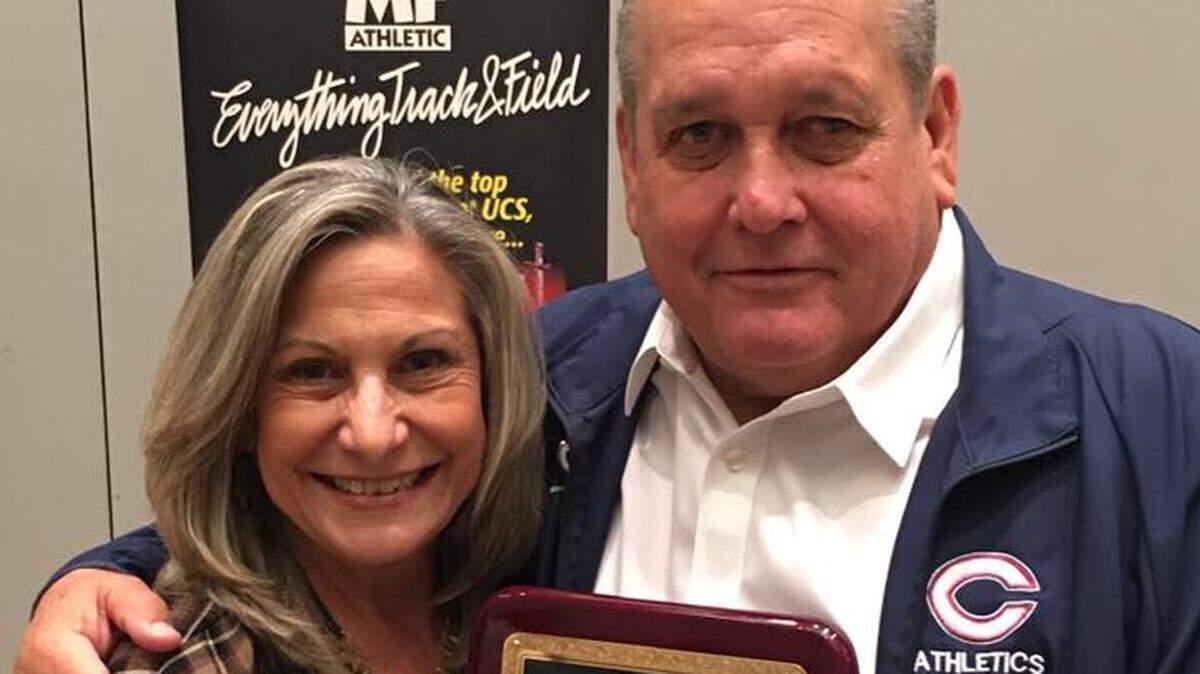 Columbus track coach Fred Foyo with his wife, Maria, on Jan. 9, 2020. He was presented with the Track Coach of the Year Award for his 2019 championship from the Florida Athletic Coaches Association.