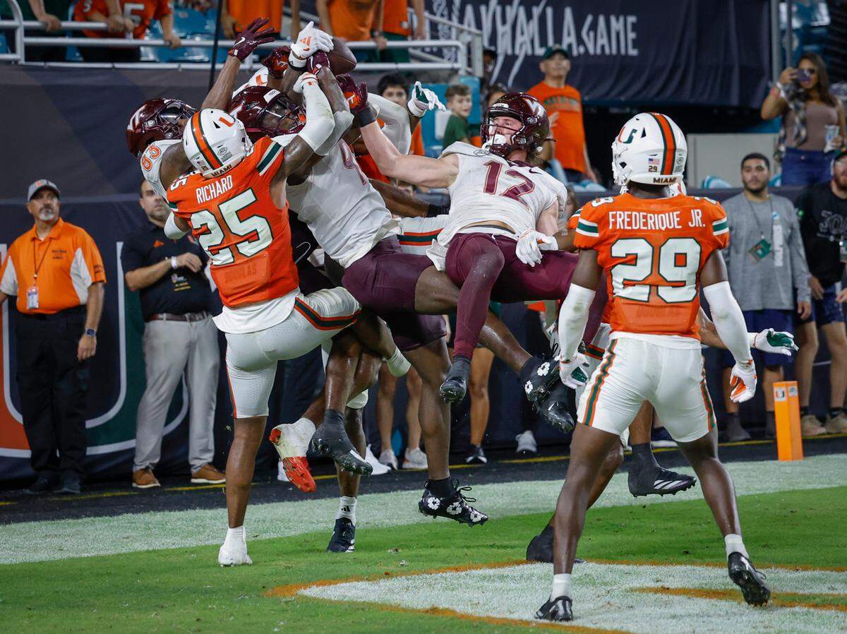 The game ended with a Virginia Tech Hail Mary attempt that was initially ruled a 30-yard, game-winning, walk-off touchdown pass from Virginia Tech Hokies quarterback Kyron Drones (1) to wide receiver Da’Quan Felton (9) but the call was overturned after a lengthy review at the ACC conference football game at Hard Rock Stadium on Friday, September 27, 2024, in Miami Gardens, Fla.