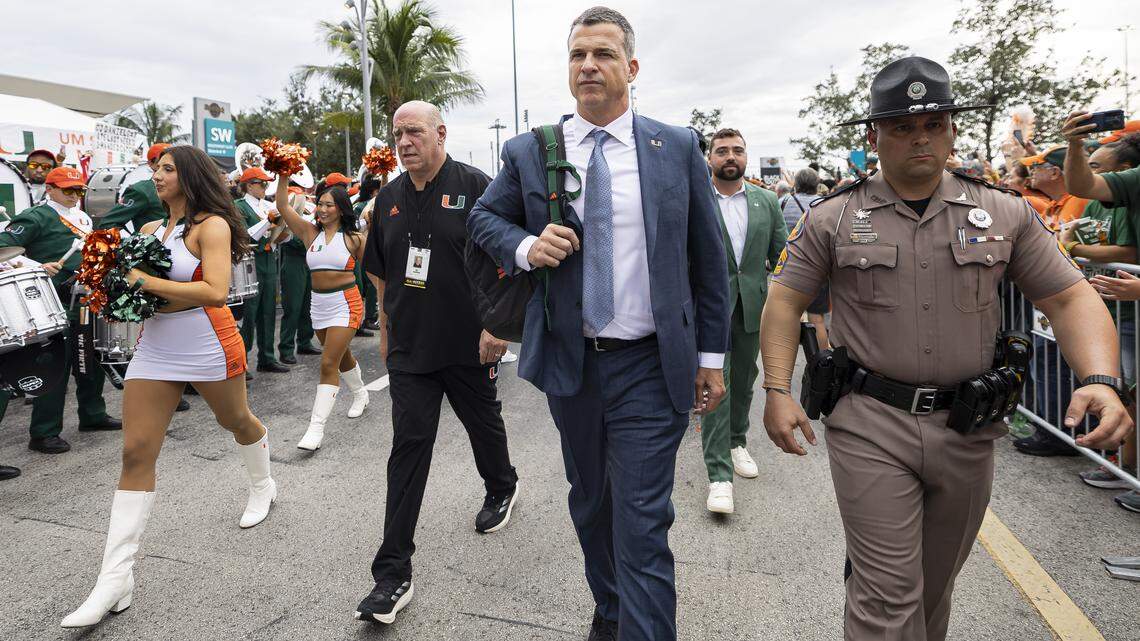 Miami Hurricanes head coach Mario Cristobal makes his way into Hard Rock Stadium before his team plays against the Bethune-Cookman Wildcats in their NCAA football game on Saturday, Sept. 6, 2025, in Miami Gardens, Fla.
