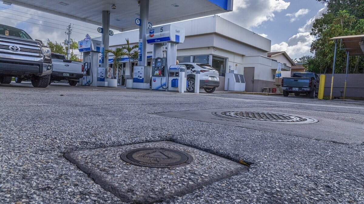 View of a monitoring well manhole cover in the grounds of a Chevron gas station located in the Morningside neighborhood in Miami.