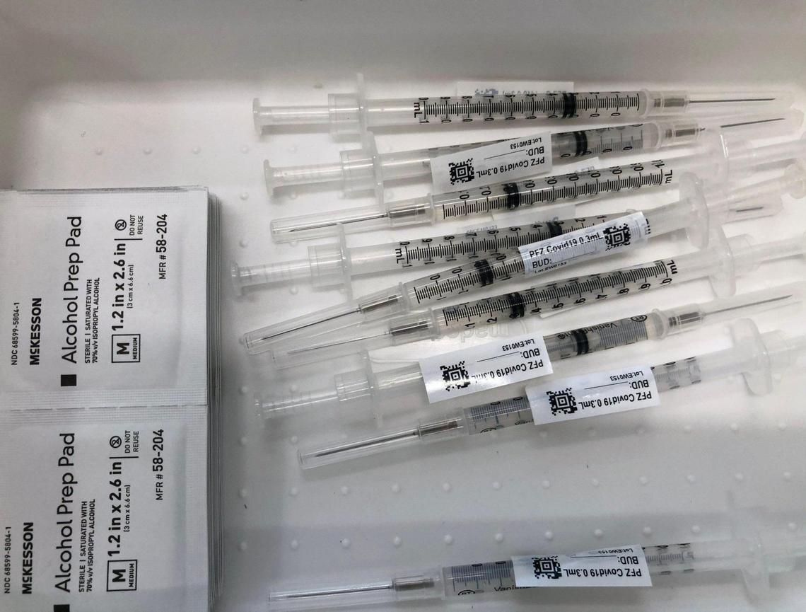 Pfizer vaccinations are sorted to be administered to university students.