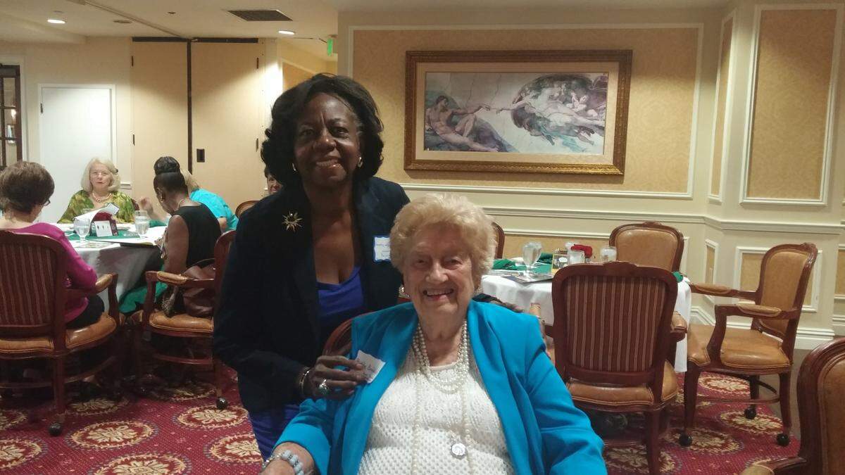 Dorothy Jenkins Fields, standing, with Ruth Fenner Braddock, who was honored at the Women’s History Coalition of Miami-Dade County annual luncheon in 2016.