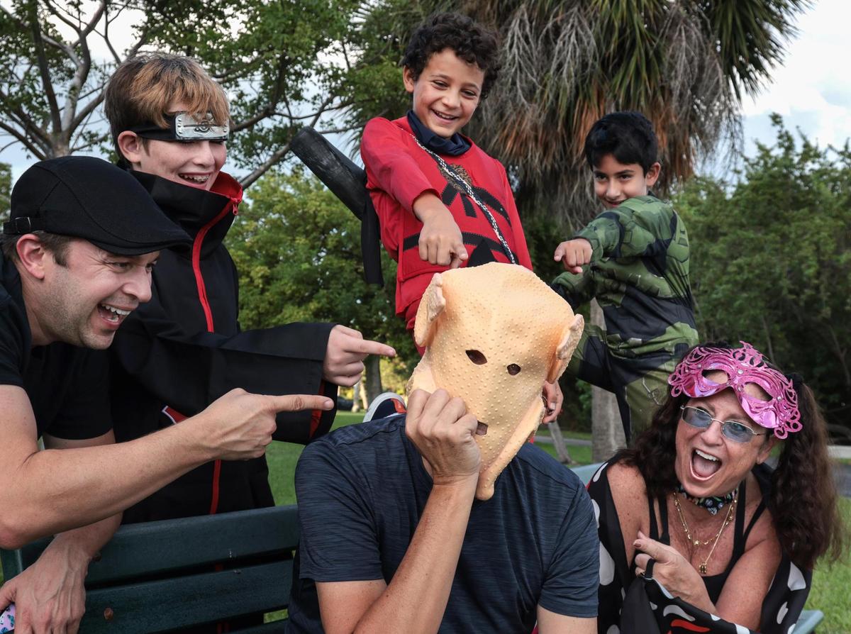 Nicolas Lund-Larson, center, and his ‘Turkey Mask’ are the butt of a joke by Mark Malpica, left, Samuel “Sam” Lund- Larson, 12, Mathieu Parry, 10, Sajoni Ortiz, 8, and Rochelle Rosen, right.