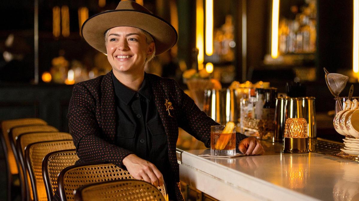 Chef Eileen Andrade strikes a pose at the bar of her restaurant, Amelia’s 1931, on Thursday, June 15, 2023, in Miami, Florida.
