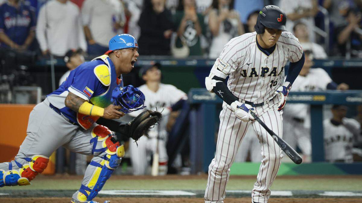 Venezuela catcher Salvador Perez (13) reacts after Japan designated hitter Shohei Ohtani (16) flies out sharply to Venezuela shortstop Ezequiel Tovar (14) to end the game at the World Baseball Classic at loanDept park on Saturday, March 14, 2026.