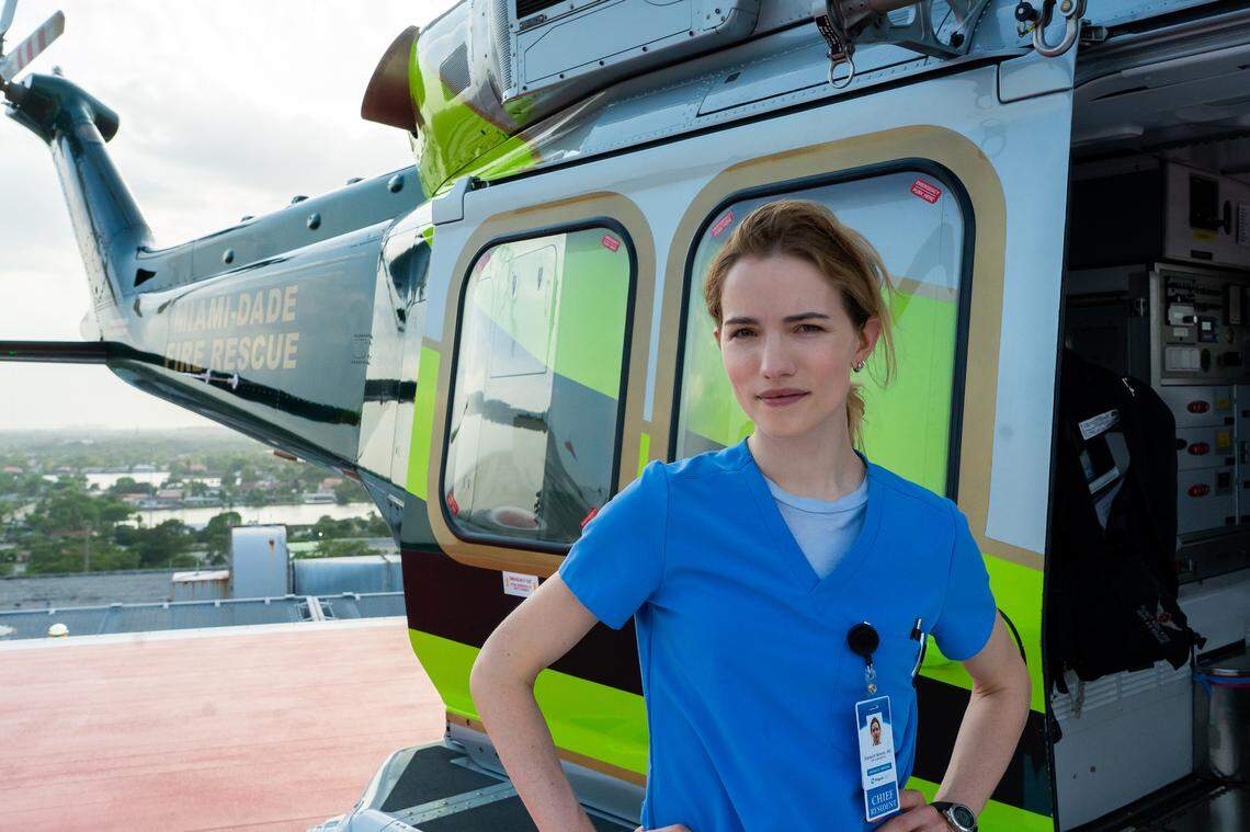 PULSE. Willa Fitzgerald as Dr. Danny Simms standing in front of a Miami-Dade Fire Rescue helicopter behind the scenes of Episode 104 of Pulse. Cr. Myrna Suarez/Netflix © 2024