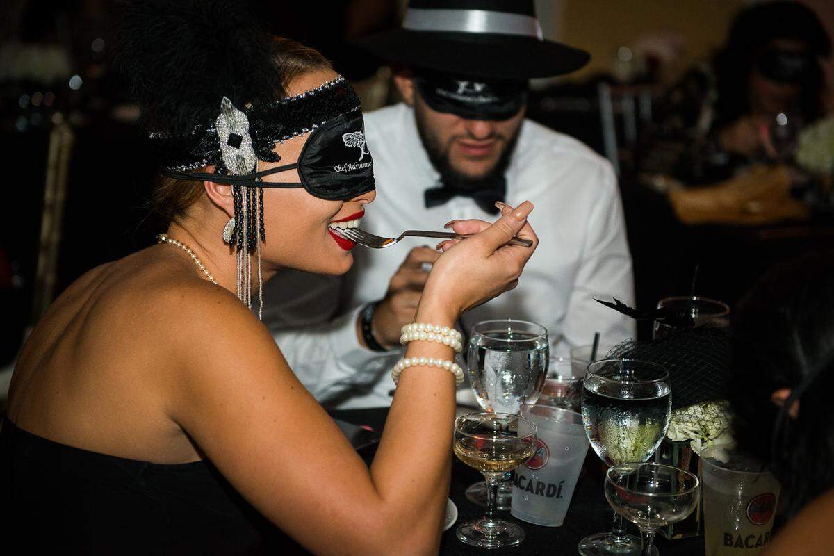 Diners at Dark Dining at Chef Adrianne’s restaurant in Kendall. The themed nights highlight the cuisine of different regions.