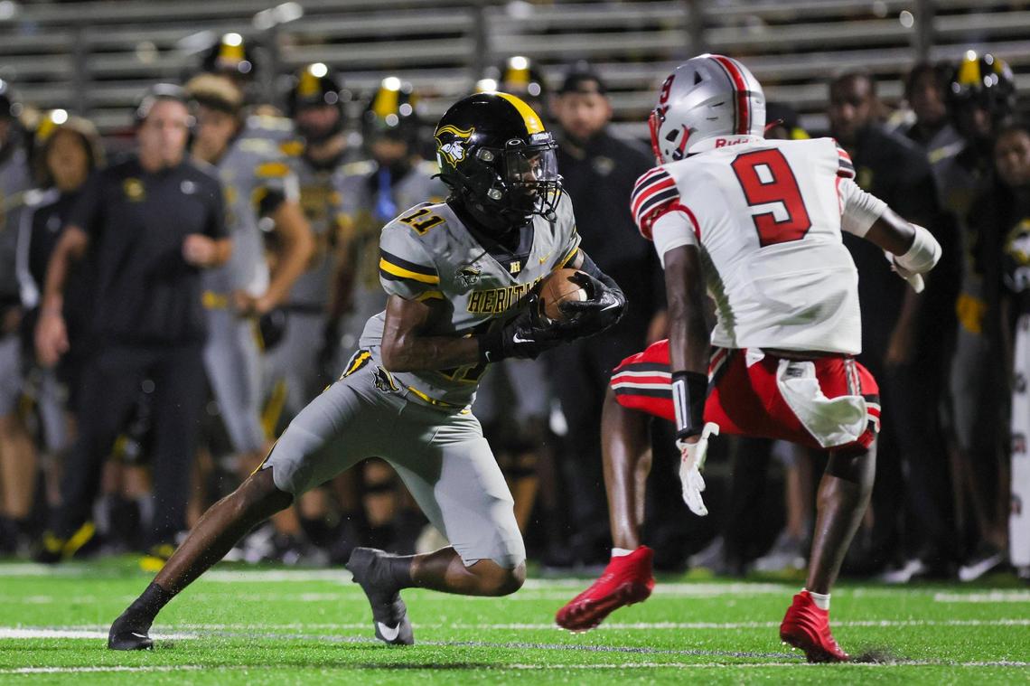 American Heritage wide receiver Brandon Bennett (11) runs with the football for a touchdown against the St. John’s Cadets during the second quarter of a high school football game at American Heritage School in Plantation, Florida on Saturday, August 26, 2023.