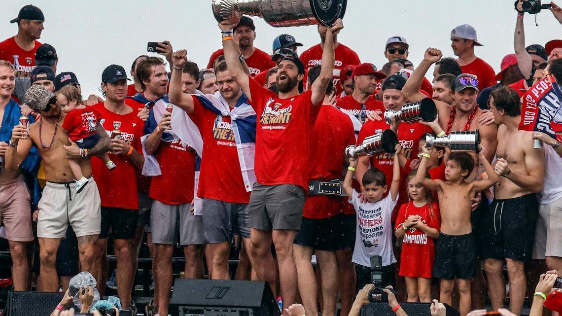 Florida Panthers defenseman Aaron Ekblad (5) raises the Stanley Cup during the Florida Panthers Stanley Cup victory rally along A1A in Fort Lauderdale, Florida on Sunday, June 30, 2024.
